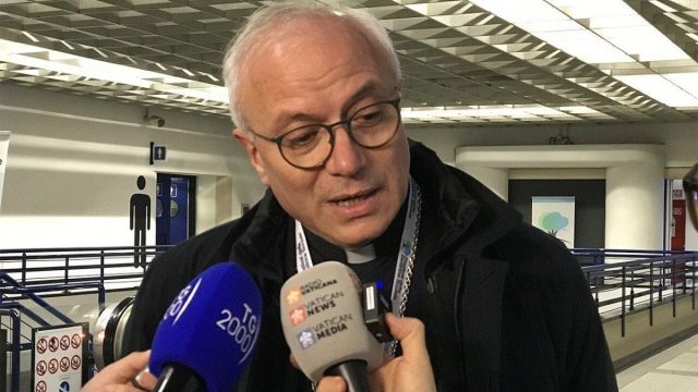 Archbishop Giuseppe Baturi of Cagliari speaking with a group of young people