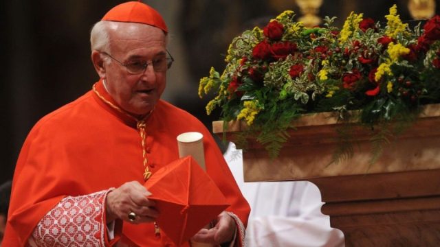 Cardinal Walter Brandmüller in choir dress seated among bishops during a synod session