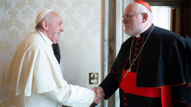 Cardinal Reinhard Marx greeting Pope Francis