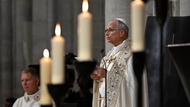 Pope Leo XIV in prayer inside the restored Cathedral of Notre-Dame in Paris