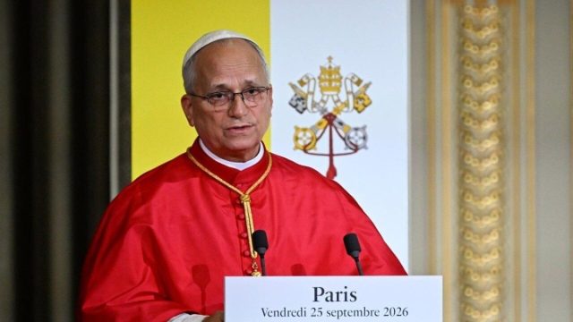 Pope Leo XIV speaking at a lectern during his address at the Élysée Palace in Paris