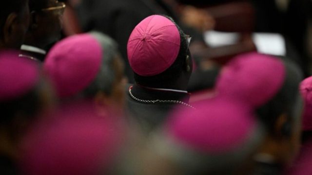 Pope Leo XIV speaking to newly appointed bishops seated in the Synod Hall at the Vatican