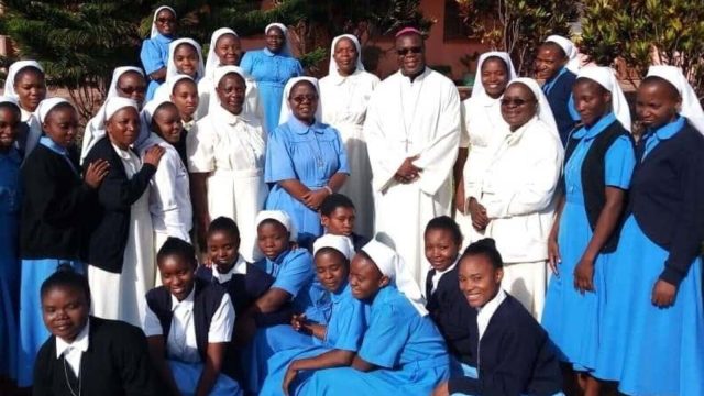 Sisters of Mercy standing outside the new SOM Hub shopping center in Mansa, Zambia