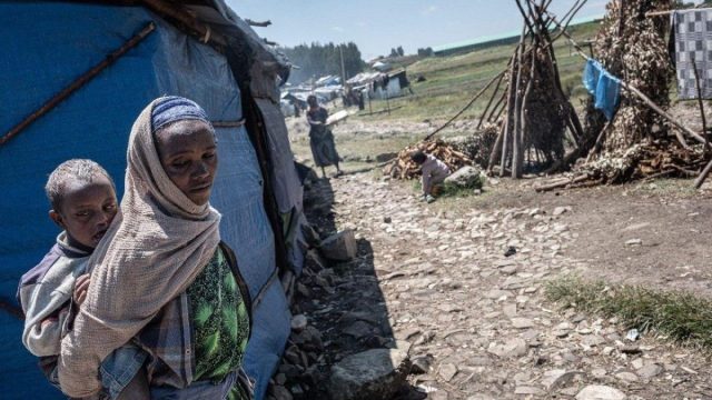 Mourners gather after attacks that killed at least 60 Orthodox Christians in the Arsi zone of Oromia, Ethiopia