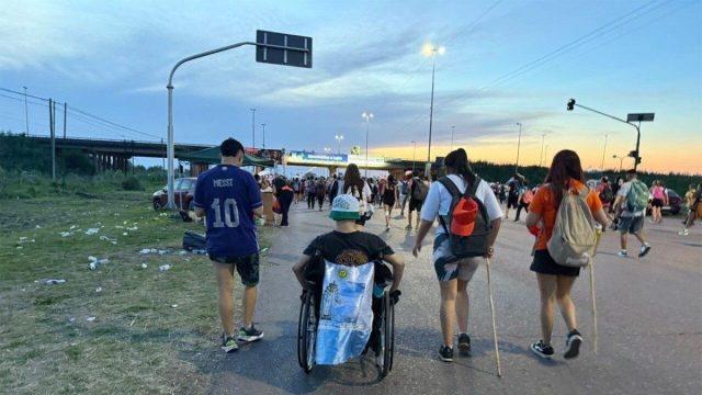 Pilgrims walking in a crowd along the route to the Basilica of Our Lady of Luján in Buenos Aires province