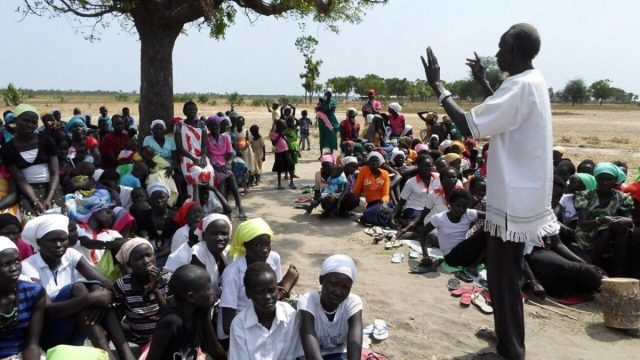 Missionaries listening as the pope's message for World Mission Day is read